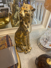 Jaguar statue i gull